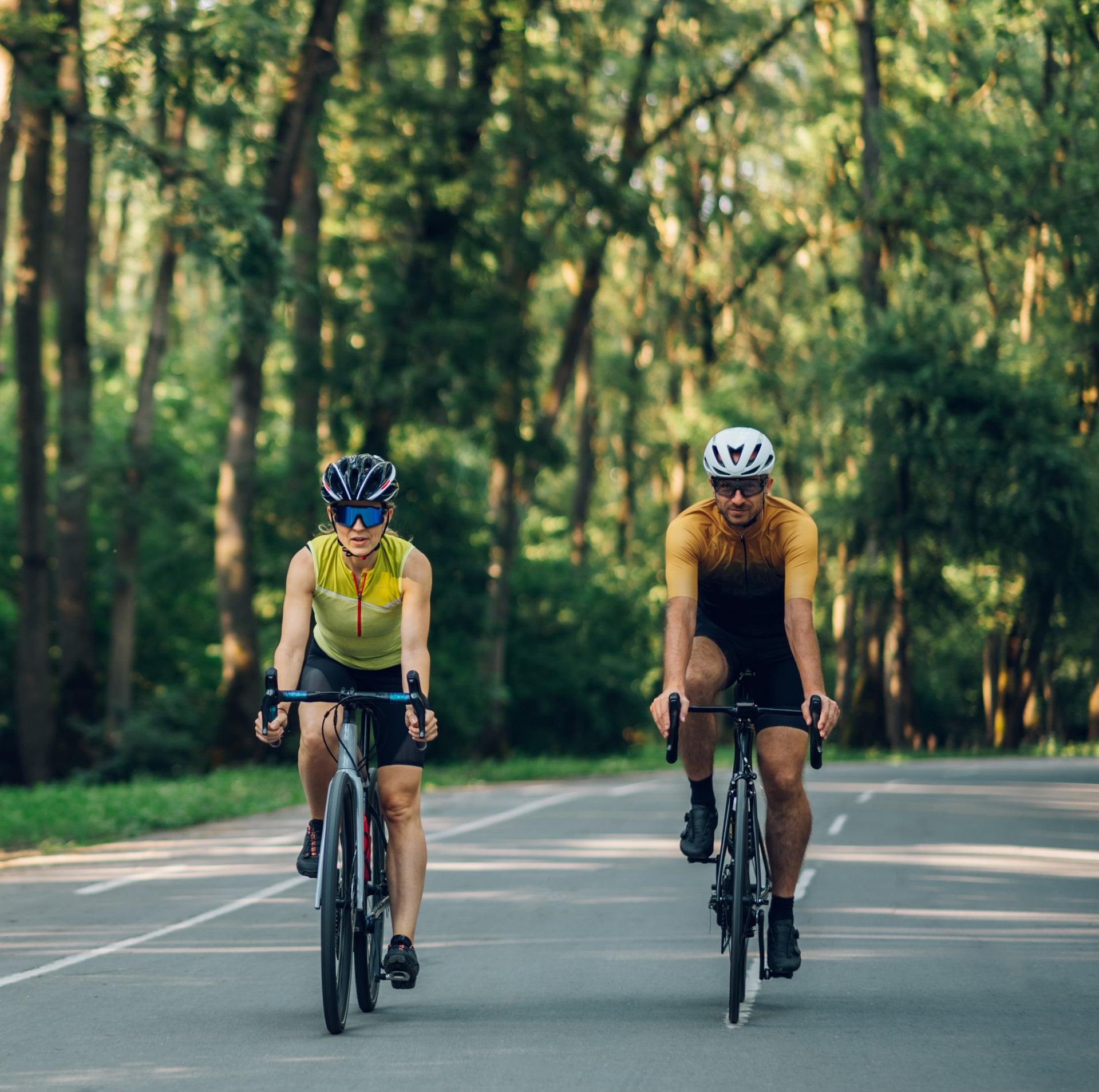Two cyclists participating in a marathon outside the city